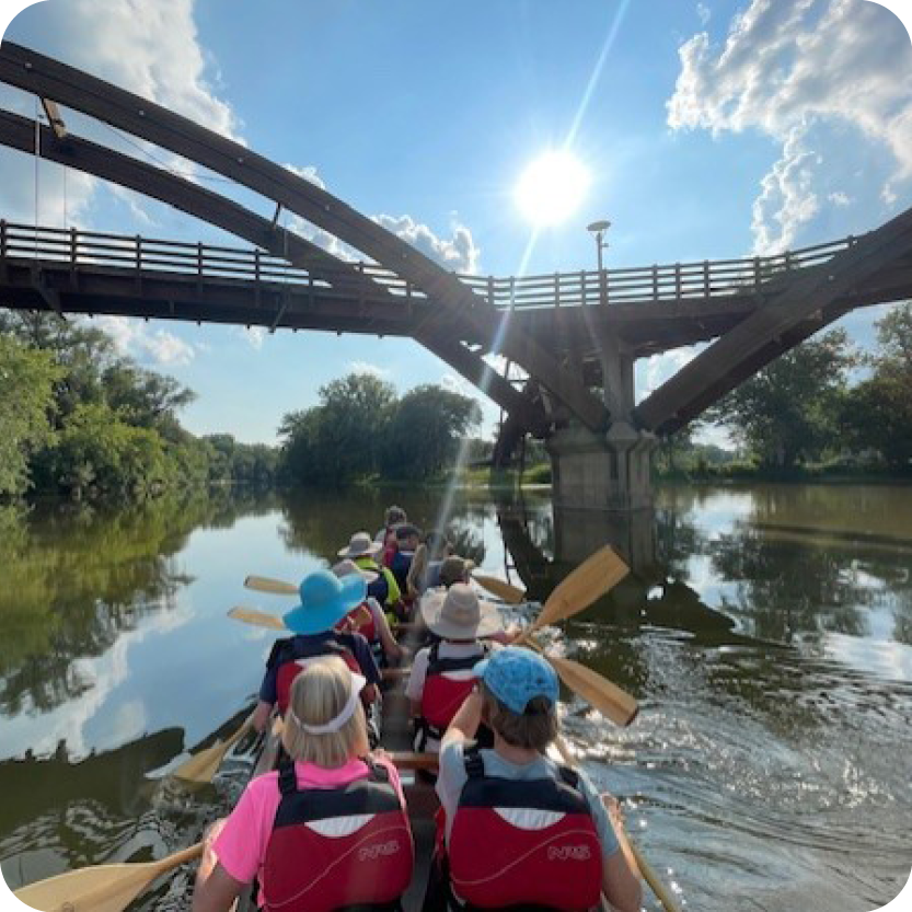 Voyageur Canoe Trip in front of the Tridge 3 sided bridge in Midland Michigan