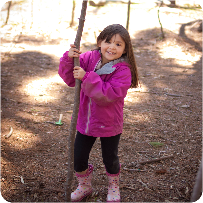 Story Hour - Young girl playing outside and learning about nature